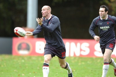 31.10.06  Wales rugby training, Cardiff  Former Wales captain Gareth Thomas passes watched by new captain Stephen Jones.  