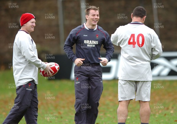 31.10.06  Wales rugby training, Cardiff  Wales hooker Matthew Rees(centre) jokes with Neil Jenkins(lt) and Rowland Phillips(rt) of the coaching staff. 