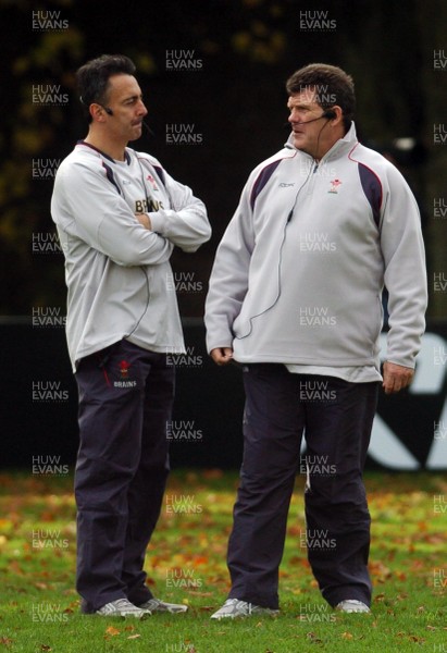 31.10.06 - WALES RUGBY Coach Gareth Jenkins (R) and assistant Nigel Davies oversee a training session ahead of their sides clash against Australia 