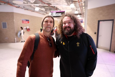 060325 - Picture shows the Wales Rugby team traveling to Edinburgh for their 6 Nations game on Saturday - Comedian Rhod Gilbert and Adam Jones, Scrum Coach at Edinburgh Airport