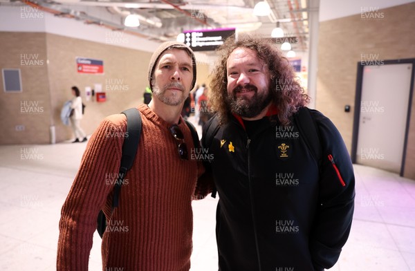 060325 - Picture shows the Wales Rugby team traveling to Edinburgh for their 6 Nations game on Saturday - Comedian Rhod Gilbert and Adam Jones, Scrum Coach at Edinburgh Airport