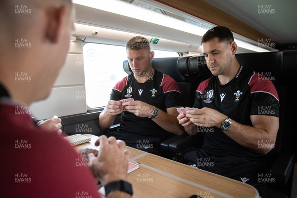 051023 - Wales Rugby travel to Nantes from Paris ahead of their final Rugby World Cup Pool game against Georgia - Dan Biggar and Tomos Williams play cards