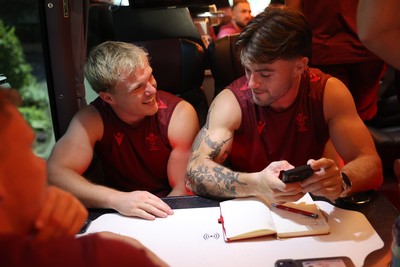 250626 - The Welsh Rugby team travel to London ahead of their game against the Barbarians at Twickenham on Saturday - Blair Murray and Joe Roberts