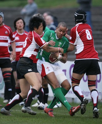 01.04.09 Wales U20 Select v Japan U20... Wales' Jamie Davies is tackled by Shohei Takeshita and Michiro Takai. 