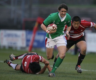 01.04.09 Wales U20 Select v Japan U20... Wales' Rhys Downes beats tackle by Yuta Onodera. 