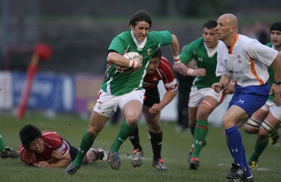 01.04.09 Wales U20 Select v Japan U20... Wales' Rhys Downes beats tackle by Yuta Onodera. 