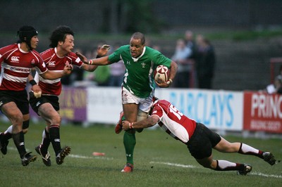 01.04.09 Wales U20 Select v Japan U20... Wales' Jamie Davies is tackled by Shorei Takeshita. 