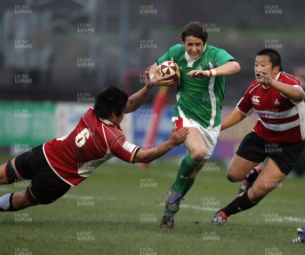 01.04.09 Wales U20 Select v Japan U20... Wales' Rhys Downes beats tackle by Yuta Onodera. 