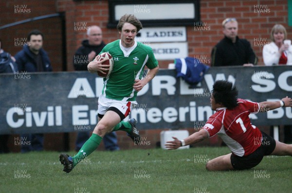 01.04.09 Wales U20 Select v Japan U20... Wales' Nick Reynolds beats tackle by Hiroaki Sugimoto to score try. 