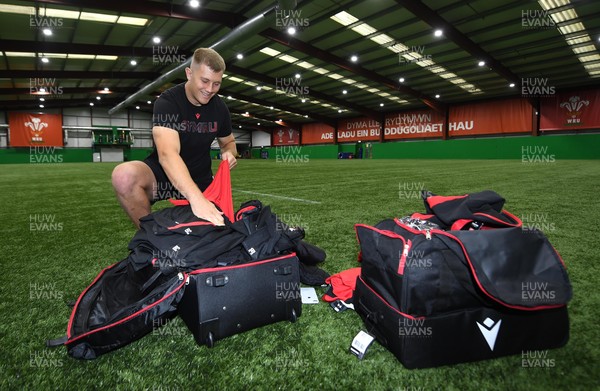 181021 - Wales Rugby Squad First Day of Camp - Ben Carter looks through his kit bag during the Wales squads first day of camp