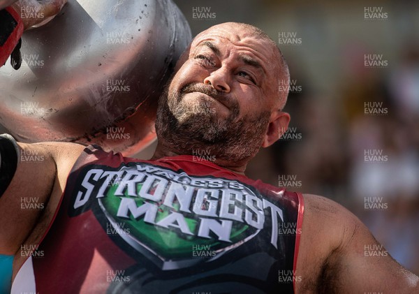 170722 - Picture shows Nathan Young competing in the sunshine at this years Wales� Strongest Women competition as the country contends with an extreme red weather warning heatwave