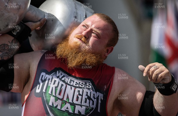 170722 - Picture shows Josh Edwards competing in the sunshine at this years Wales� Strongest Women competition as the country contends with an extreme red weather warning heatwave