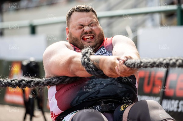 170722 - Picture shows William Jones competing in the sunshine at this years Wales� Strongest Women competition as the country contends with an extreme red weather warning heatwave