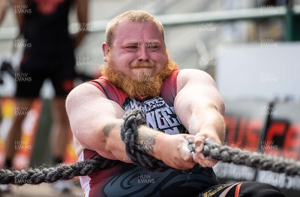 170722 - Picture shows Josh Edwards competing in the sunshine at this years Wales� Strongest Women competition as the country contends with an extreme red weather warning heatwave