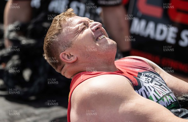 170722 - Picture shows Mark Jeanes competing in the sunshine at this years Wales� Strongest Women competition as the country contends with an extreme red weather warning heatwave