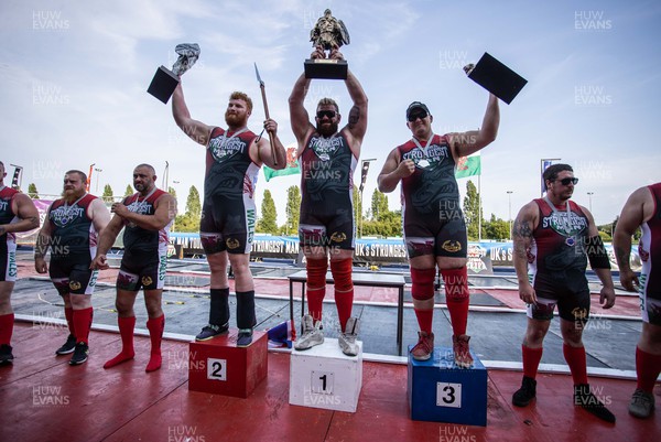 170722 - Picture shows top 3 Mark Jeanes (3rd), Luke Sperduti (2nd) and David Ramplee (1st) competing in the sunshine at this years Wales� Strongest Women competition as the country contends with an extreme red weather warning heatwave