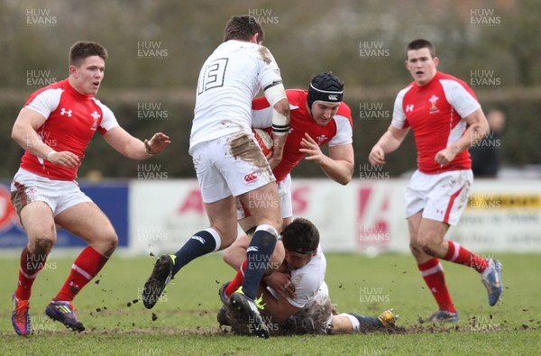 170313 - Wales Students v England Students, Clifton RFC - Wales' Jonathan Barley is tackled by England's Tom Dunn and England's Alex Dancer