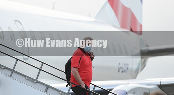 030222 - Wales Rugby team arrive in Dublin - Coach Wayne Pivac leaves the plane as the Wales team arrive in Ireland ahead of this weekend opening Six Nations match