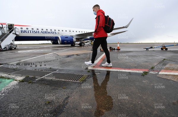 110321 - Wales Rugby team travel from Cardiff Airport to Italy ahead of this weekends Guinness 6 Nations match in Rome - Jonathan Davies boards the plane