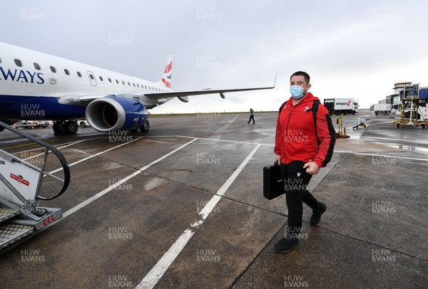 110321 - Wales Rugby team travel from Cardiff Airport to Italy ahead of this weekends Guinness 6 Nations match in Rome - Wyn Jones boards the plane
