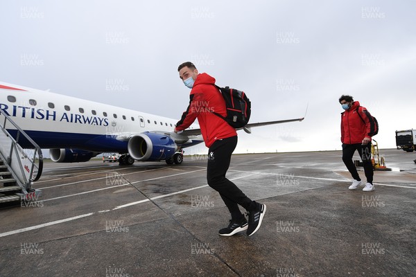 110321 - Wales Rugby team travel from Cardiff Airport to Italy ahead of this weekends Guinness 6 Nations match in Rome - George North boards the plane