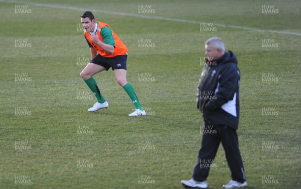 01.02.10 - Wales Rugby Training - Lee Byrne in action during training as head coach Warren Gatland looks on. 