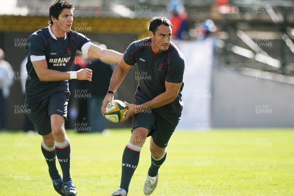 06.06.08 Wales rugby in S.Africa... Wales Sonny Parker passes watched by James Hook at the Captains Run at  the stadium in Bloemfontein which is still being renovated.   