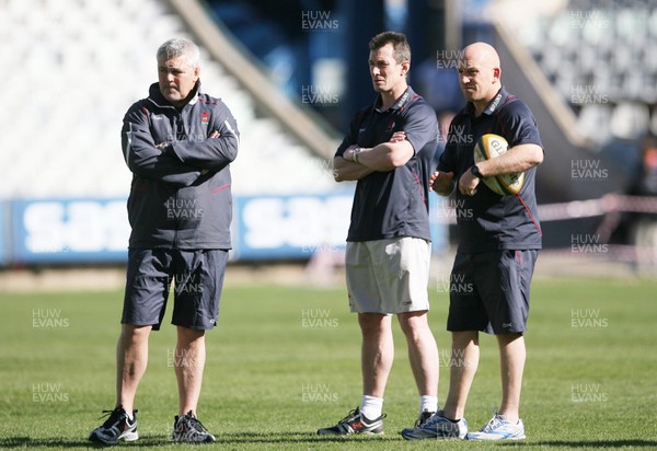 06.06.08 Wales rugby in S.Africa... Wales coaches l-r Warren Gatland, Rob Howley and Shaun Edwards at the Captains Run at  the stadium in Bloemfontein which is still being renovated.   