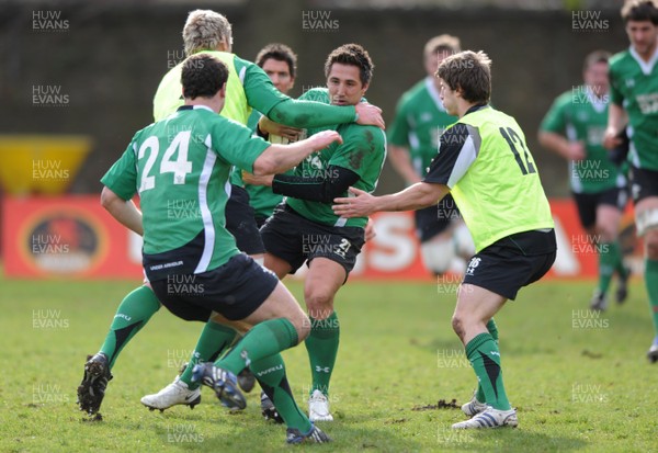 09.03.09 - Wales Rugby Training - Gavin Henson is tackled by Bradley Davies and Robin Sowden-Taylor during training. 
