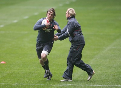 14.02.08 - Wales Rugby Training - Ryan Jones is caught by Alix Popham during training 