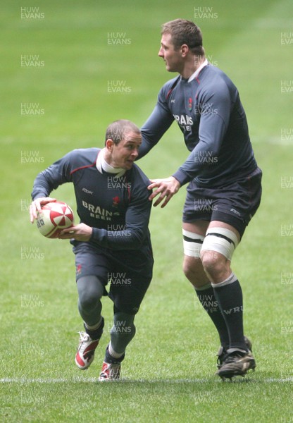 14.02.08 - Wales Rugby Training - Shane Williams is caught by Ian Gough(R) during training 