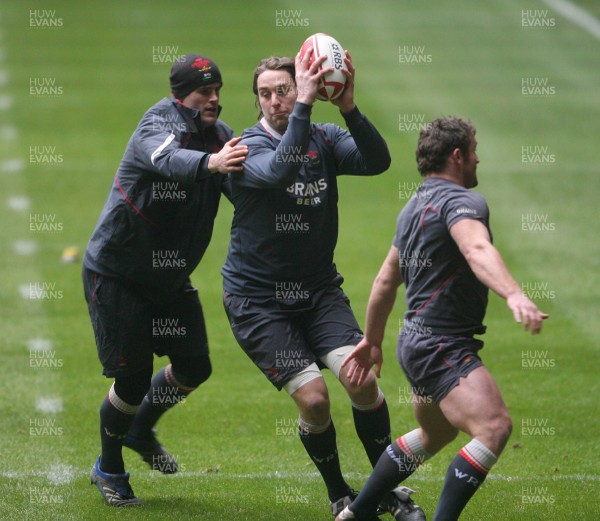 14.02.08 - Wales Rugby Training - Ryan Jones is caught by Jamie Roberts(L) during training 