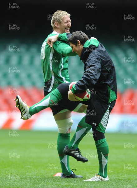 19.03.10 - Wales Rugby Training - Bradley Davies and James Hook warm up during training. 