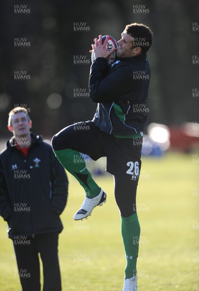 29.01.10 - Wales Rugby Training - Jamie Roberts takes high ball as attack coach Rob Howley looks on during training. 