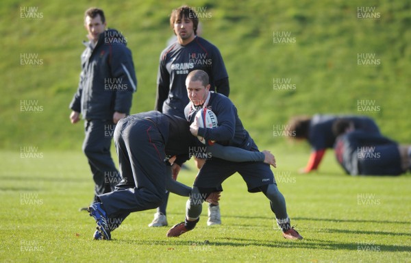 31.01.07 - Wales Rugby Training - Shane Williams is tackled by Lee Byrne during training 