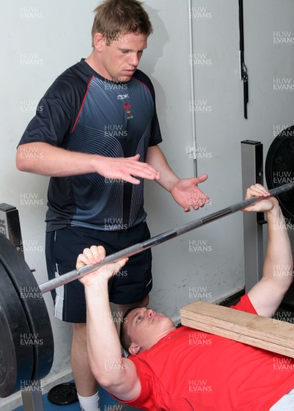24.07.07 Wales World Cup Squad Training, St. Nazaire, France Ian Evans bench presses with Rhys Thomas spotting as The Welsh team take a session in the gym at their training camp in St. Nazaire, France. Darren Griffiths/