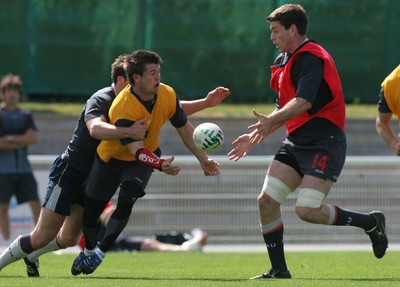 25.07.07 Wales World Cup Squad Training, St. Nazaire, France Ceri Sweeney slips a pass to Michael Owen during full contact training at  Wales' training camp in St. Nazaire, France. 