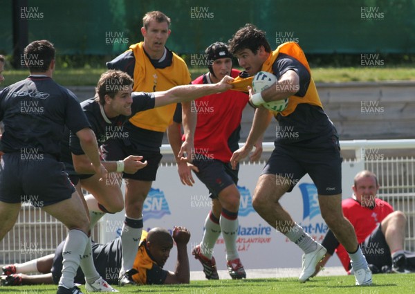 25.07.07 Wales World Cup Squad Training, St. Nazaire, France Mike Phillips gets collared by Gavin Evans during full contact training at  Wales' training camp in St. Nazaire, France. 