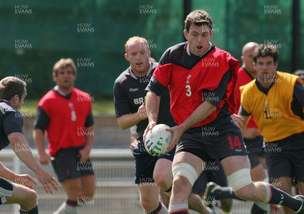 25.07.07 Wales World Cup Squad Training, St. Nazaire, France Michael Owen looks to pass as Kevin Morgan moves into tackle during full contact training at  Wales' training camp in St. Nazaire, France. 