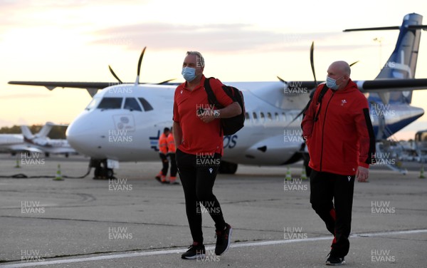 221020 - Wales Rugby Squad Travel to Paris - Wayne Pivac and Neil Jenkins gets off the plane after arriving in Paris