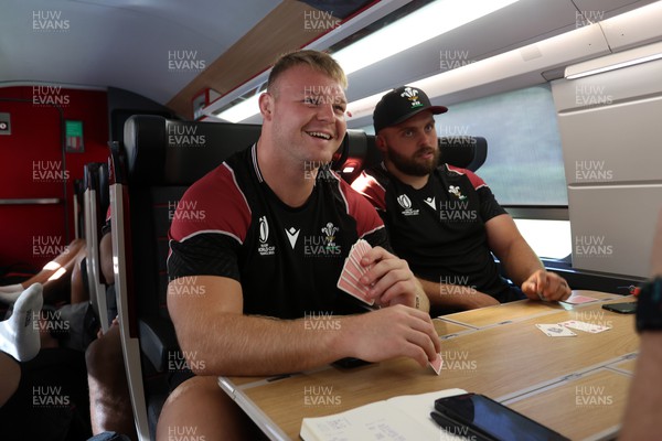 070923 - The Wales Rugby Travel from Paris to Bordeaux on the train ahead of their opening Rugby World Cup game - Dewi Lake playing cards