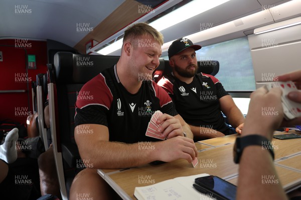 070923 - The Wales Rugby Travel from Paris to Bordeaux on the train ahead of their opening Rugby World Cup game - Dewi Lake playing cards