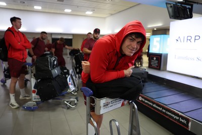 130726 - Wales Rugby team travel to South Africa from Argentina - Eddie James