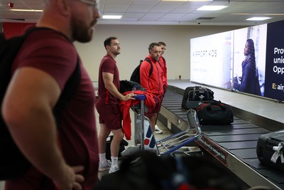 130726 - Wales Rugby team travel to South Africa from Argentina - Tomos Williams