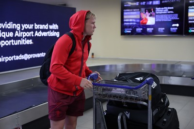 130726 - Wales Rugby team travel to South Africa from Argentina - Blair Murray