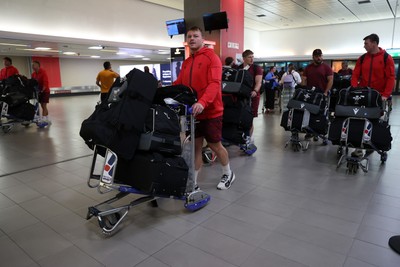 130726 - Wales Rugby team travel to South Africa from Argentina - Dewi Lake