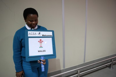130726 - Wales Rugby team travel to South Africa from Argentina - Locals welcome the team