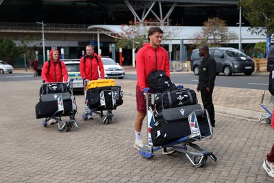 130726 - Wales Rugby team travel to South Africa from Argentina - Teddy Williams