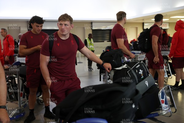 130726 - Wales Rugby team travel to South Africa from Argentina - Jac Morgan
