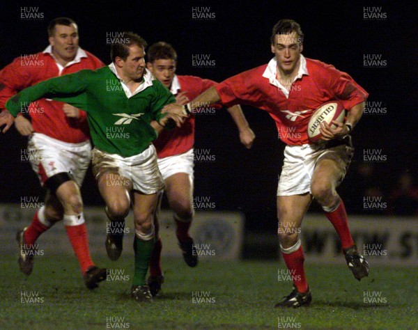 290100 - Welsh Rugby Trial Match -   Jason Jones-Hughes hands off Neil Boobyer